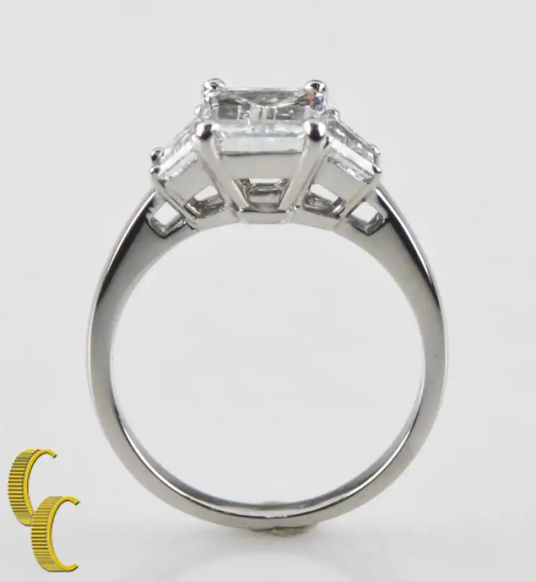 2.10-Carat-Emerald-Cut-Diamond-3-Stone-Platinum-Ring-with-GIA-Certified-3.webp