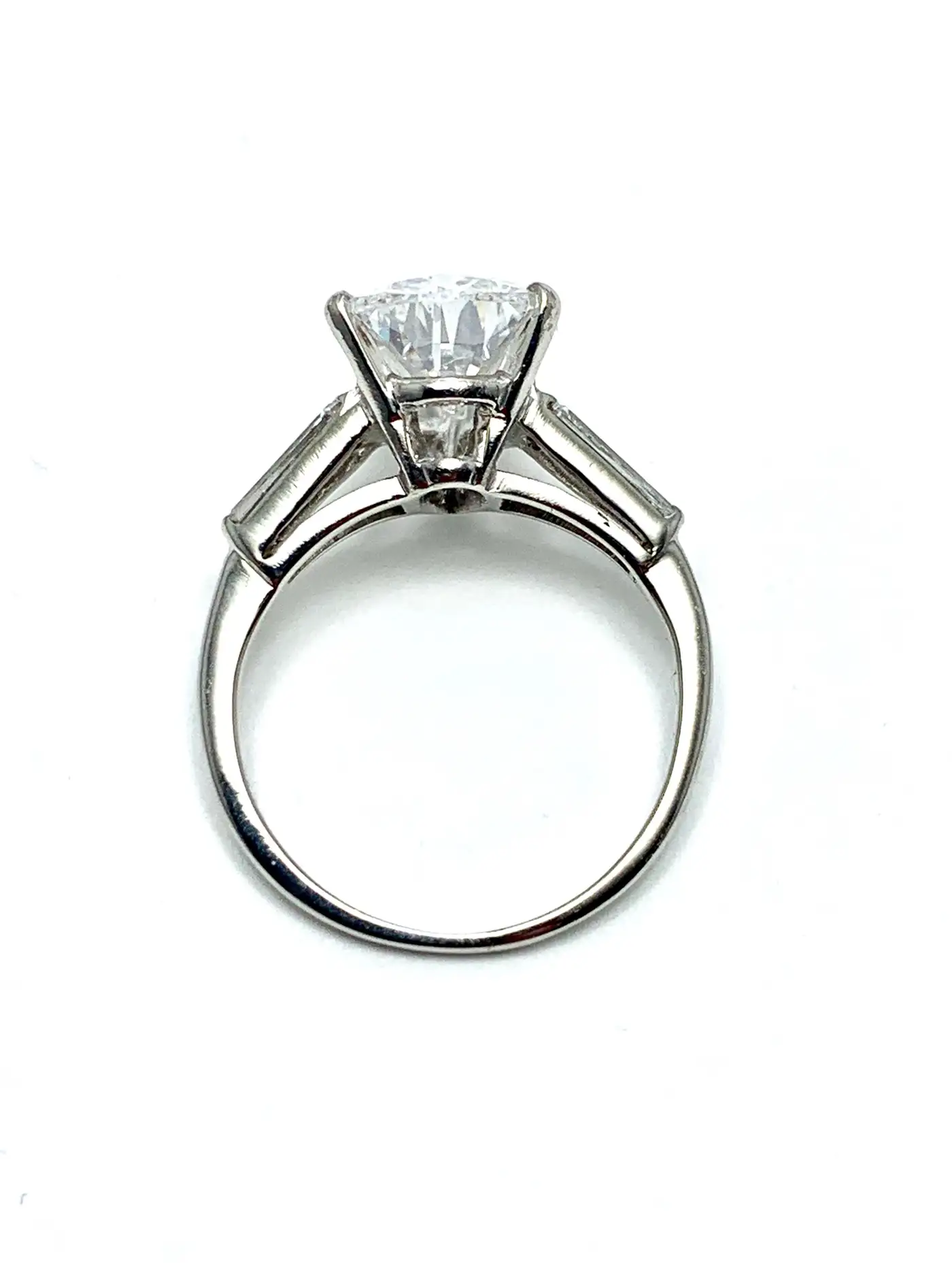 3.14-Carat-D-SI1-Pear-Shape-Diamond-and-Baguette-Diamond-Platinum-Ring-1.webp