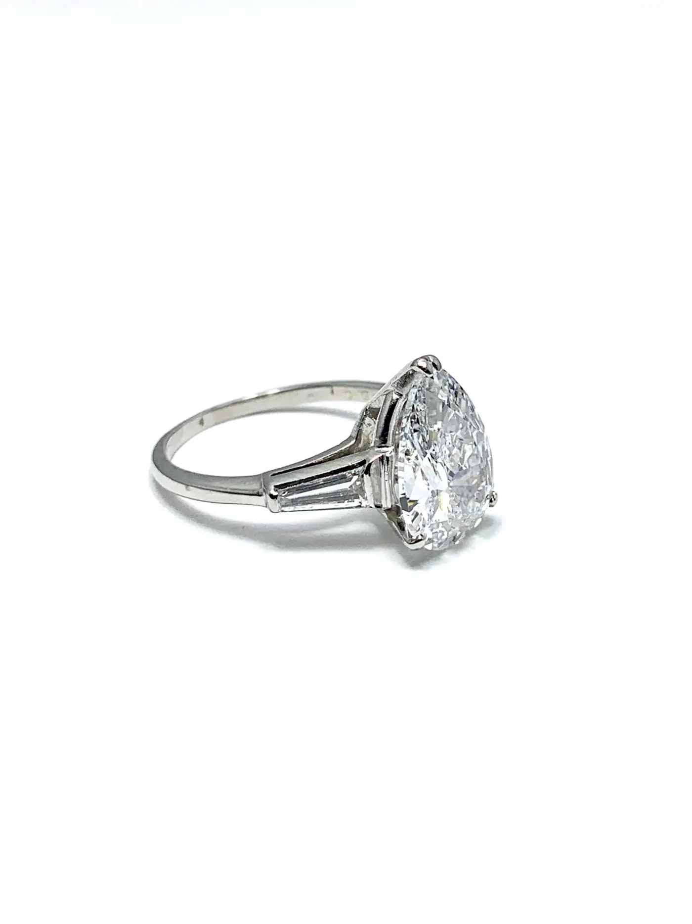 3.14-Carat-D-SI1-Pear-Shape-Diamond-and-Baguette-Diamond-Platinum-Ring-5.webp