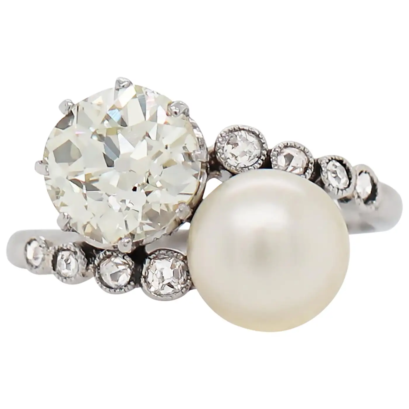 Pearl-and-1.69ct-Old-Cut-Diamond-Two-Stone-Crossover-Platinum-Ring-circa-1920s-1.webp