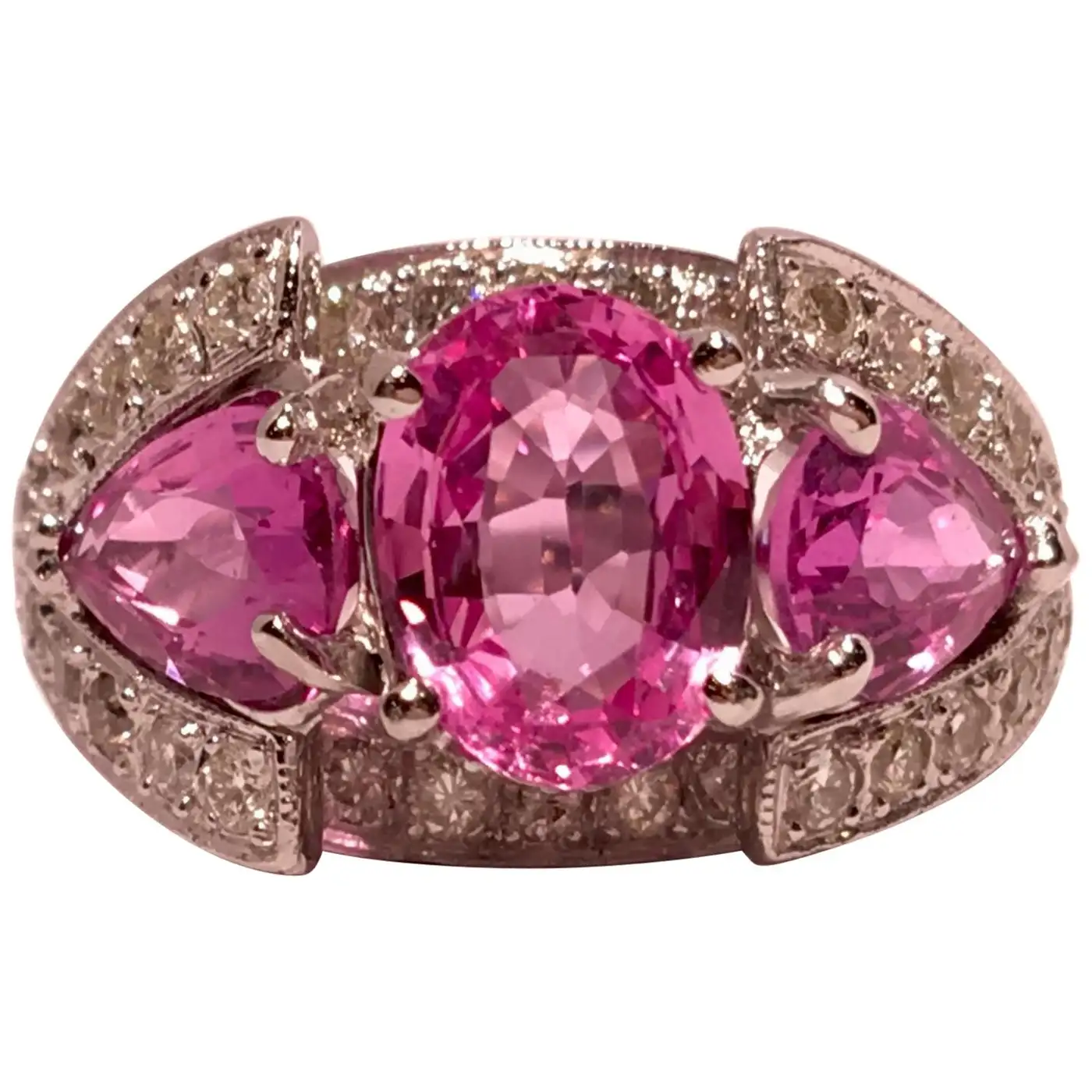 Spectacular-Vivid-Pink-Sapphire-Diamond-Platinum-Three-Stone-Ring-1.webp