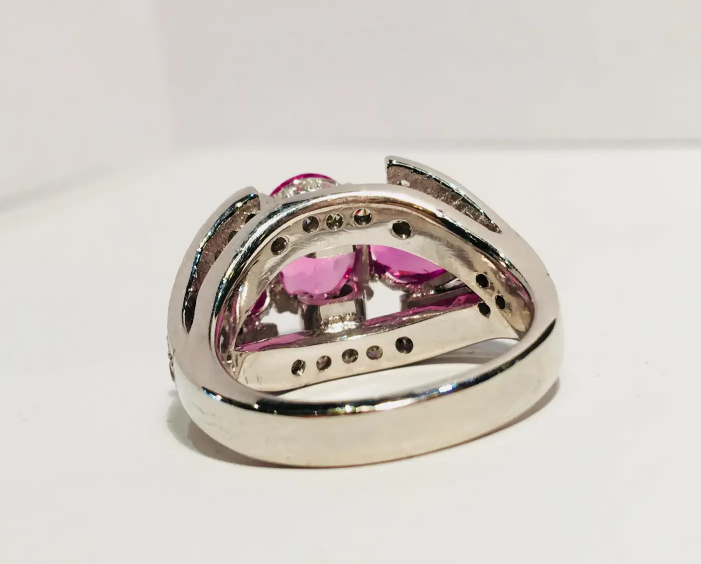 Spectacular-Vivid-Pink-Sapphire-Diamond-Platinum-Three-Stone-Ring-2.webp