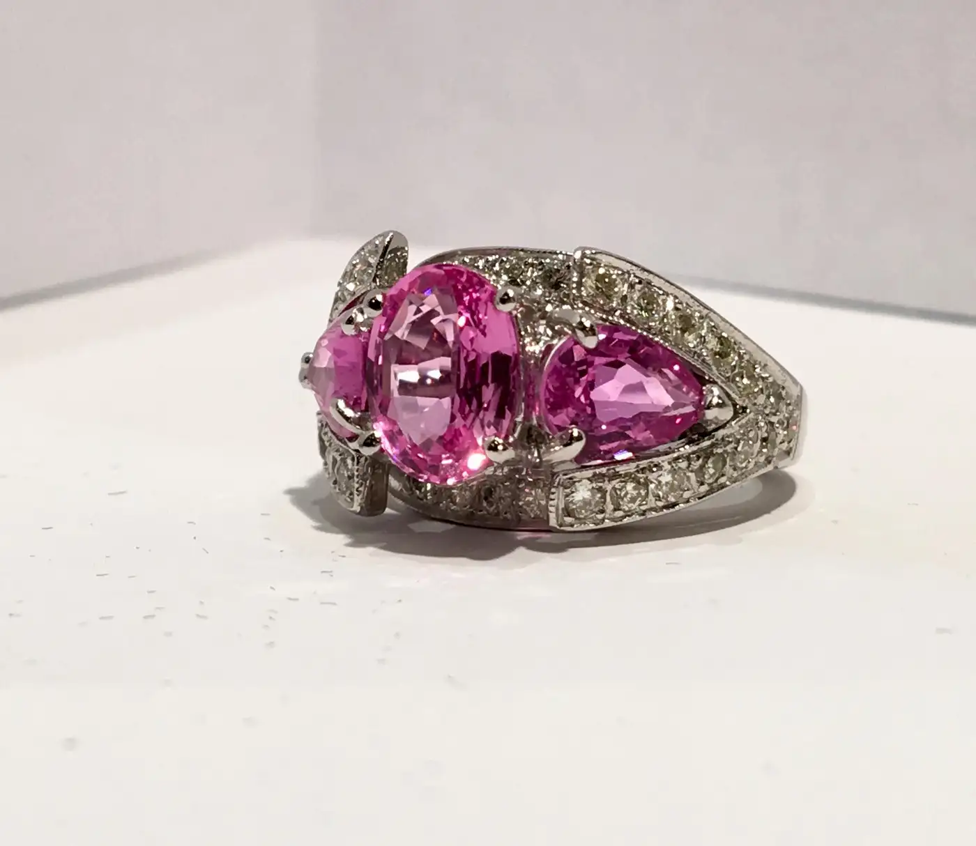 Spectacular-Vivid-Pink-Sapphire-Diamond-Platinum-Three-Stone-Ring-6.webp