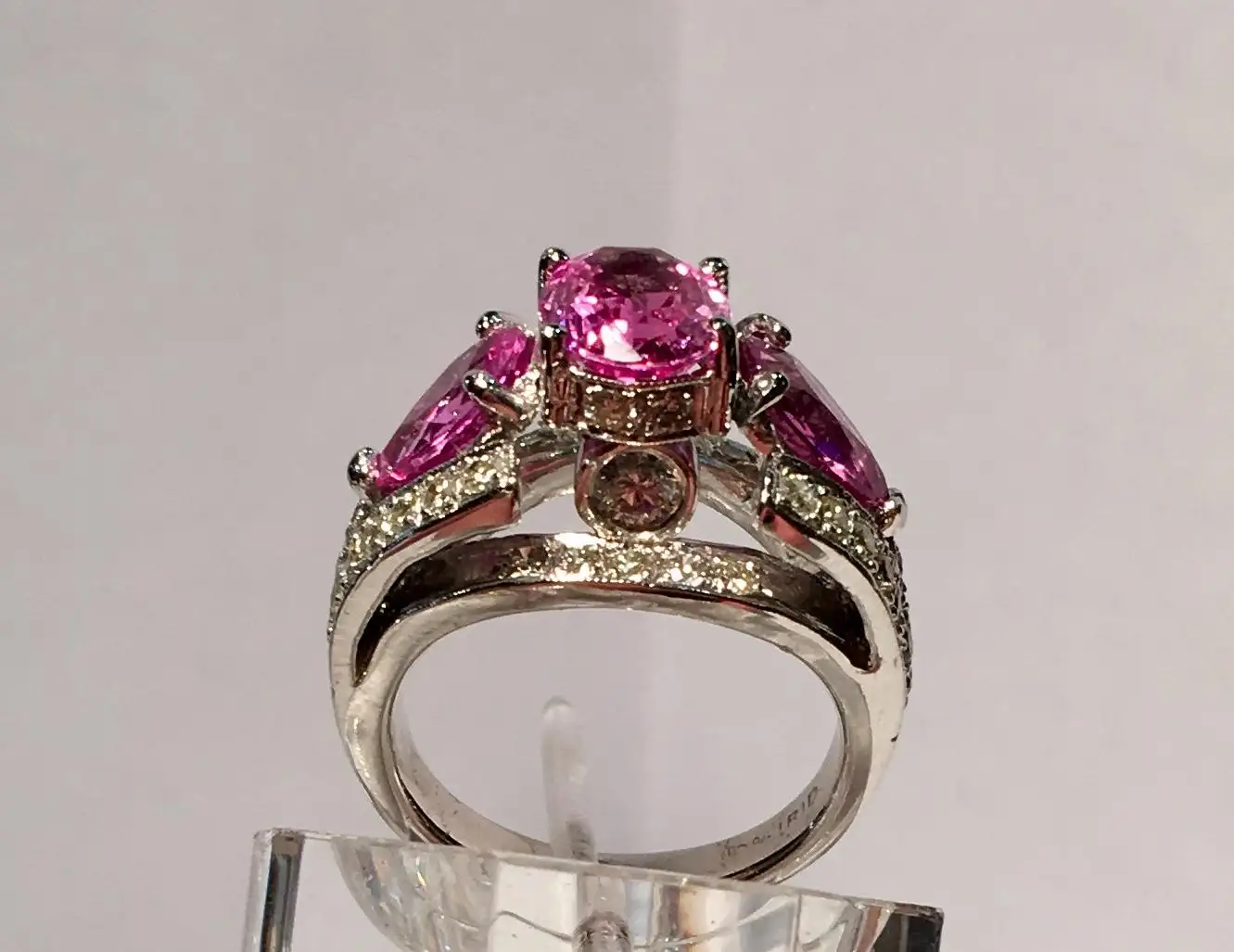 Spectacular-Vivid-Pink-Sapphire-Diamond-Platinum-Three-Stone-Ring-7.webp
